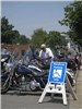 Motorcycles parked along Beacon Street while visiting the Harley Davidson set up, 2010