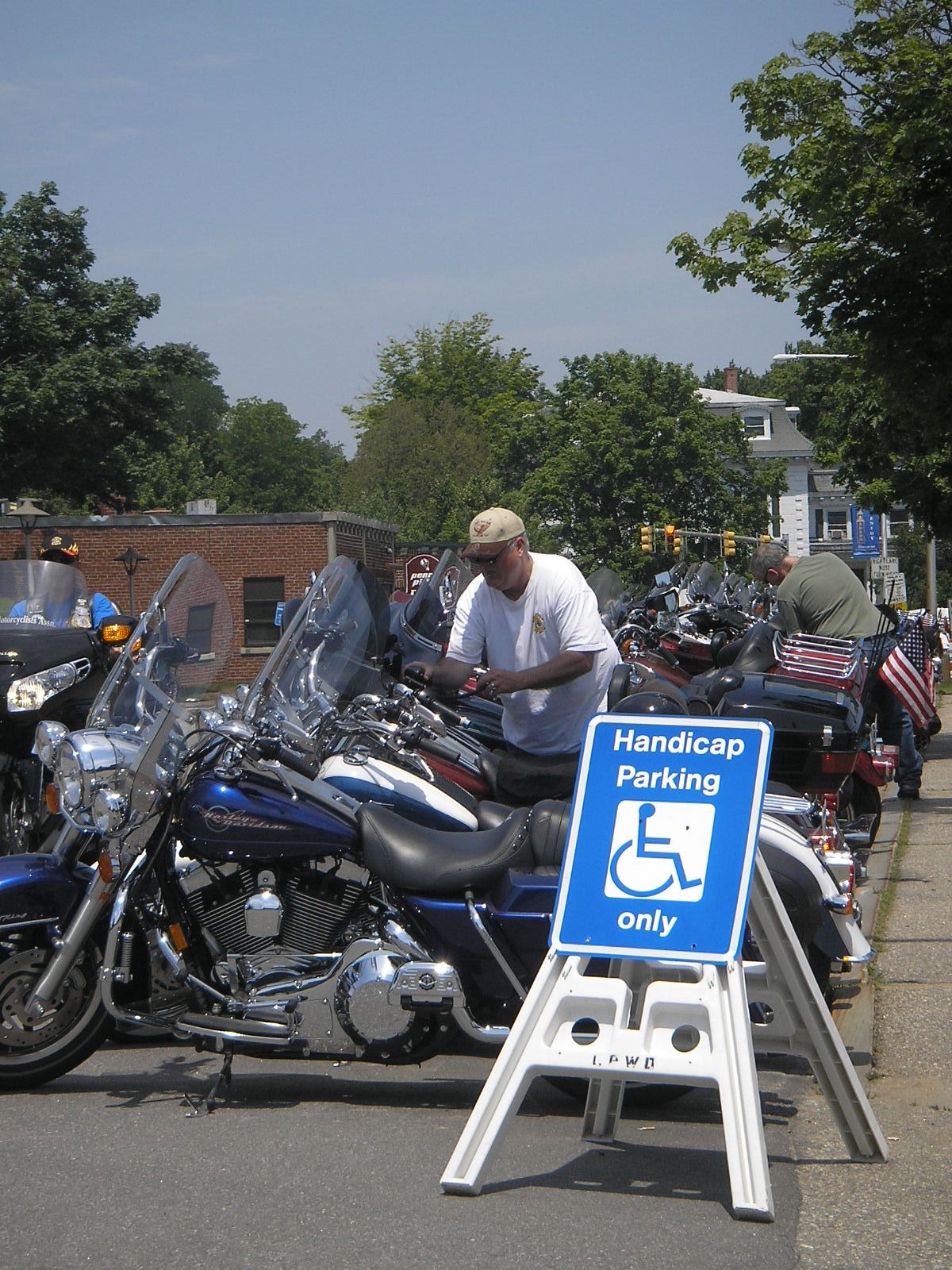Motorcycles parked along Beacon Street while visiting the Harley Davidson set up, 2010