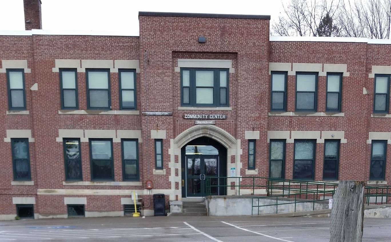 A photo of yellow tulips in front of the community center